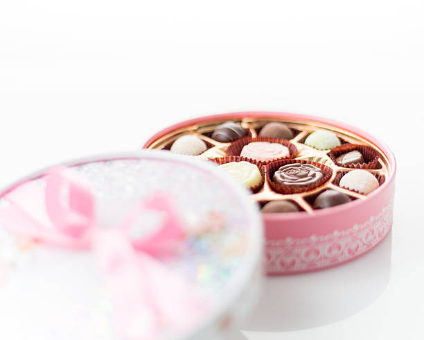 istock Chocolates in pink box on white background 534939815