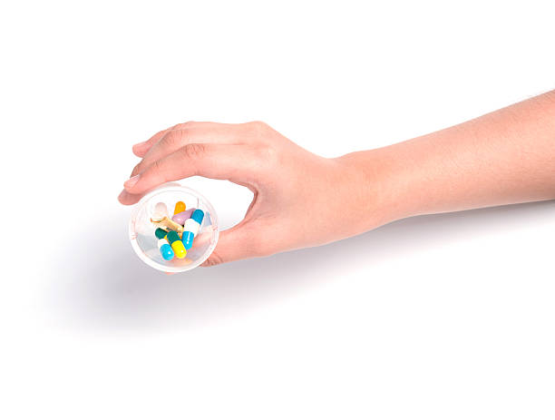 Druge capsules and pills in hand