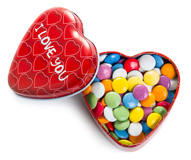 istock Heart shape box with colorful chocolate coated candy 534941129