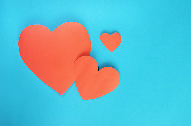 istock Red hearts paper on cyan background for Valentines day 534941409