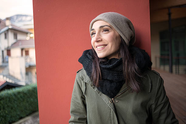 istock Woman looking out from balcony in winter 534943971