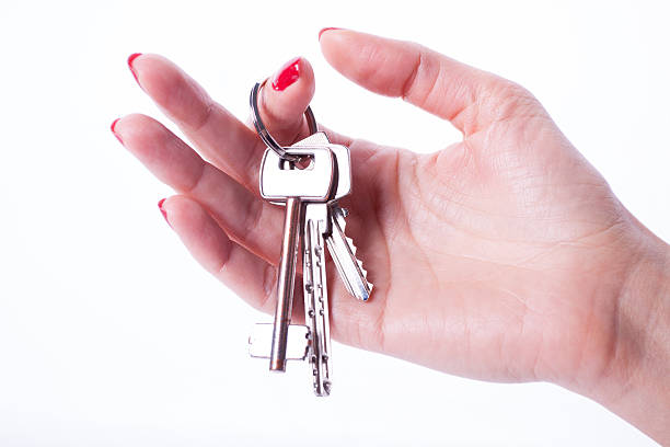 istock Woman hand holding keys 534944609