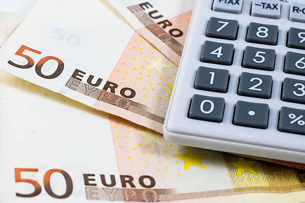 istock fifty euro bills and a calculator 534971603