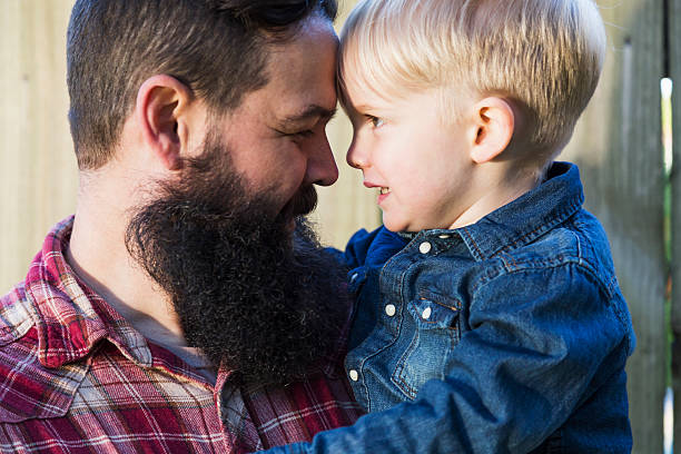 istock Bearded father carrying his cute little blond son 534971723