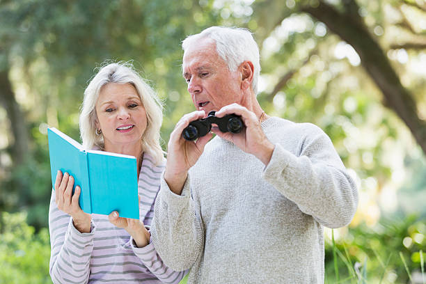 istock Senior couple in the woods birdwatching 534971823