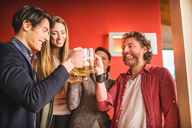 istock group of friends toasting with drinks 534972631