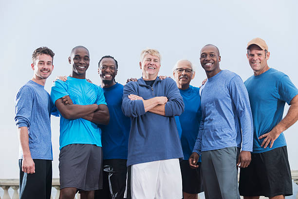 Multiracial group of men wearing blue shirts