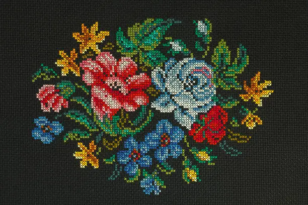 Handmade cross-stitch "Beautiful bouquet of roses, cornflowers, poppies on a black background " is my own work