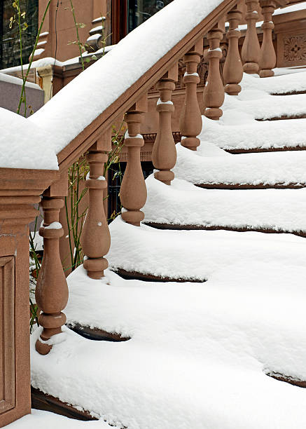 istock Snow covered staircase on Brownstone apartment building 534976883