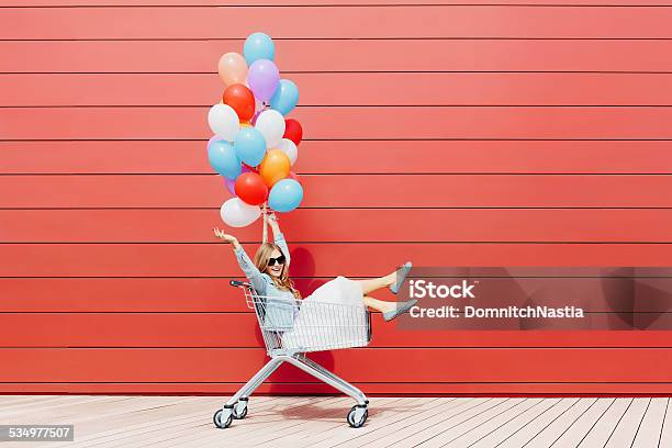 Girl Near Cart With Balloons Stock Photo - Download Image Now - 2015, Adult, Adults Only