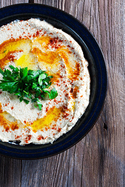 istock Fresh hummus with parsley and oil. 534979937