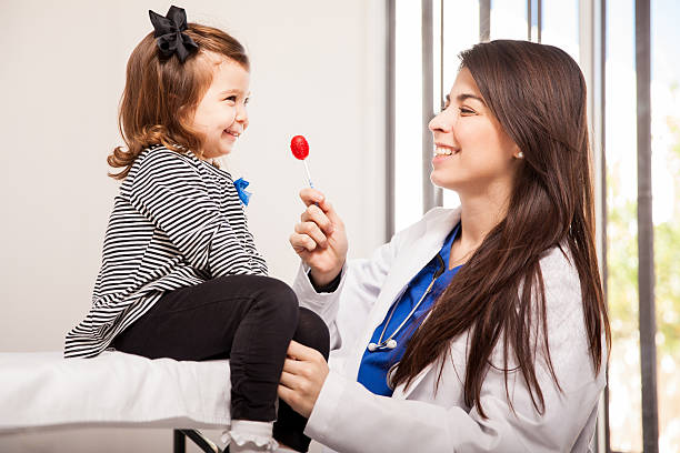 istock Pediatrician giving a lollipop 535002935