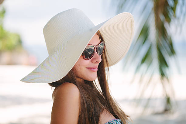 istock Beautiful woman sit on the sand 535003409