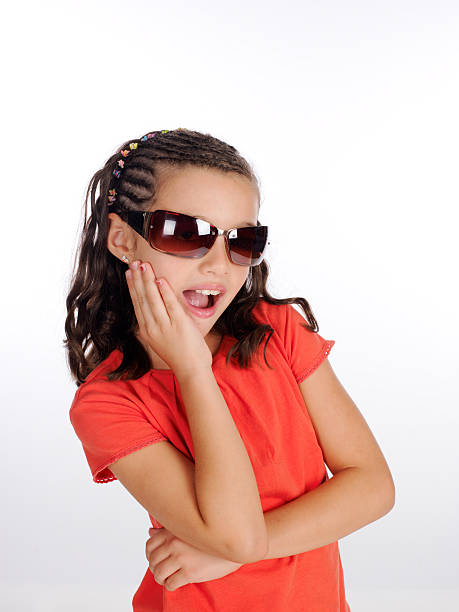 istock Girl flirting with her ​​sunglasses. 535003809