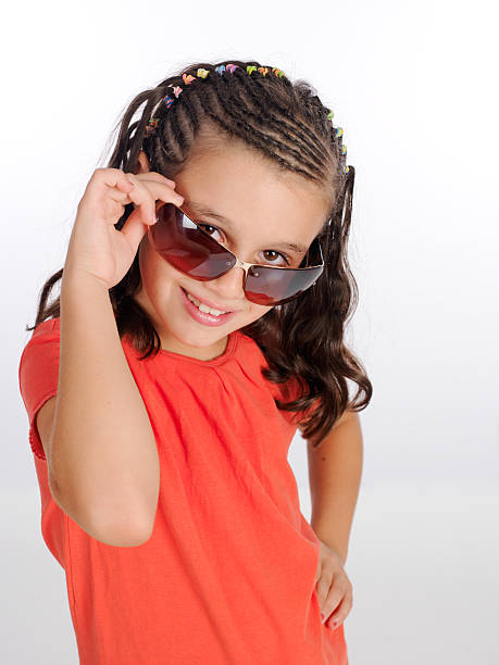 istock Girl flirting with her ​​sunglasses. 535003813
