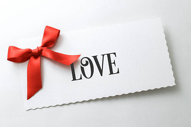 istock Valentine card with red ribbon on white background 535007259