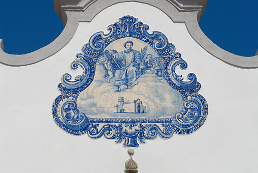 Exterior detail of the Saint Lawrence of Rome church in Almancil, Portugal. Church has one of the most beautiful in Portugal hand painted tiles (Azulejo) of the 18th century at the facade.