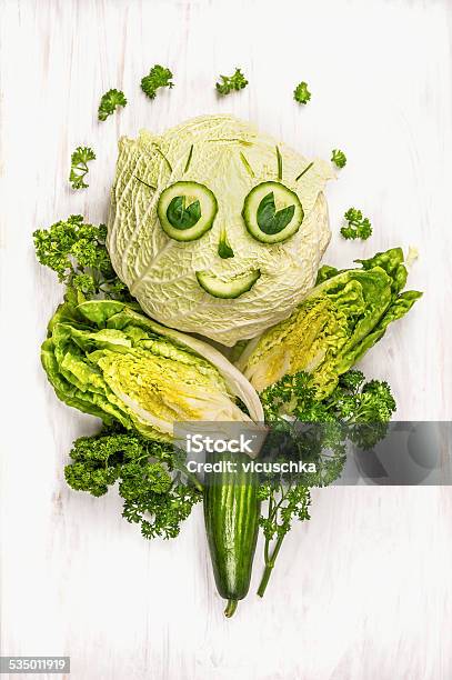 Funny Girl Face Made Of Green Vegetables Cucumber And Lettuce Stock Photo - Download Image Now