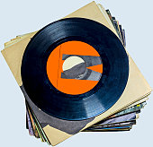 Pile of 45 RPM vinyl records used and dirty