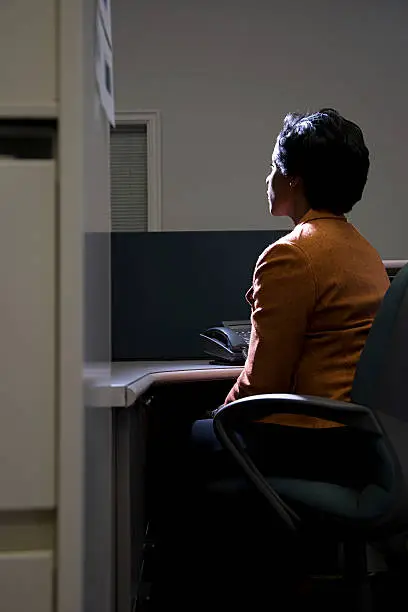 Photo of Woman in dark office