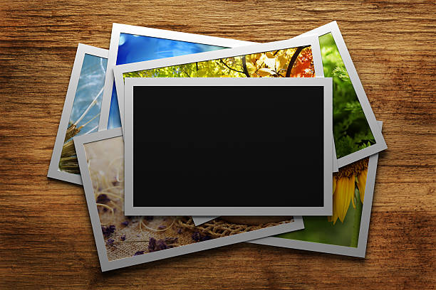 istock Pile of colorful photos with blank frame 535025865