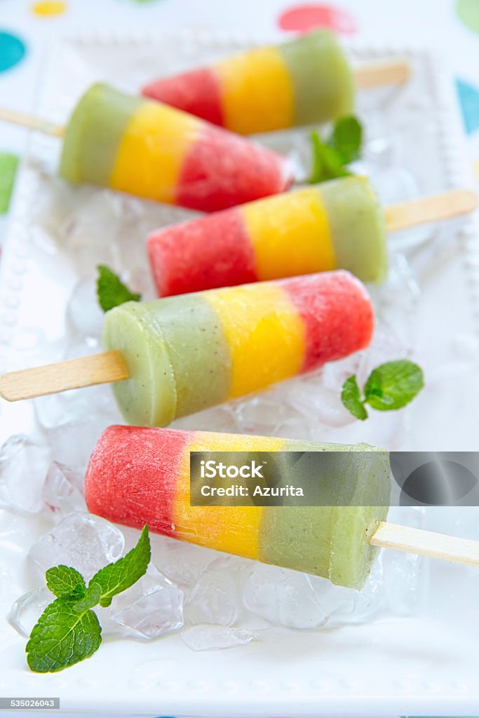 Homemade pureed fresh fruit popsicles Homemade pureed fresh fruit popsicles with strawberry, mango, peach and kiwi 2015 Stock Photo