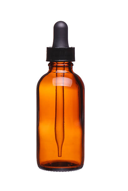 Brown medicine glass bottle with dropper isolated