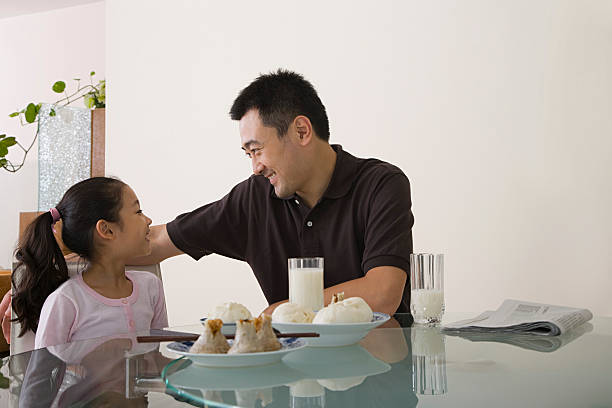 istock Father and daughter sat at a table 535028937