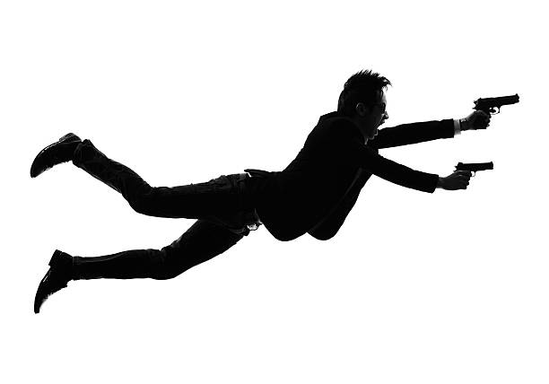 istock asian gunman killer jumping shooting  silhouette 535029021
