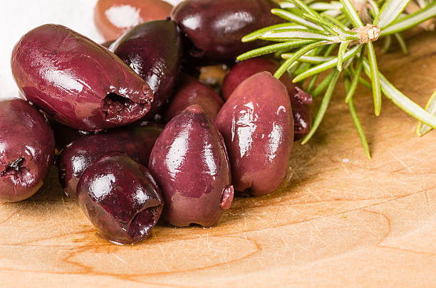 istock Kalamata olives and rosemary being prepared 535029227