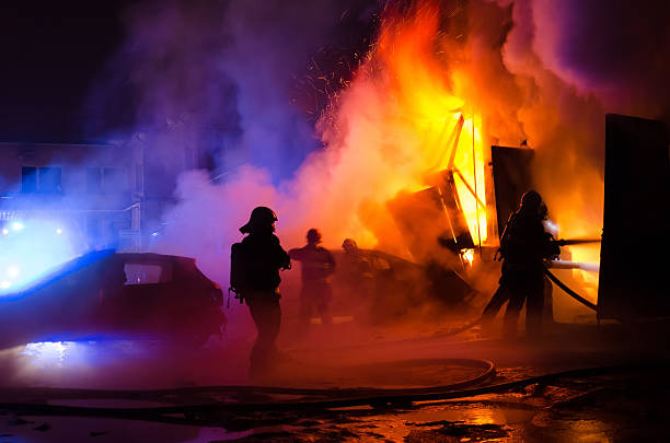 Firefighters fighting fire Several firefighters fighting garage fire. extinguishing stock pictures, royalty-free photos & images