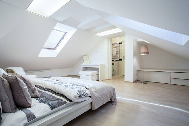 Spacious and fashionable bedroom Spacious and fashionable bedroom connected with bathroom attic photos stock pictures, royalty-free photos & images