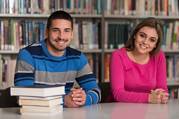 istock Group Of Young Students Sitting At The Library 535041429