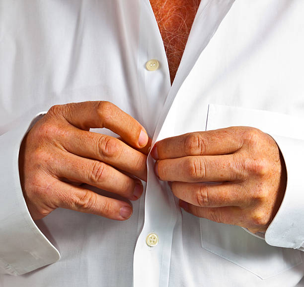 istock man closing his shirt 535045153