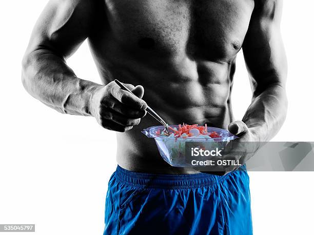 Man Exercising Fitness Exercises Eating Salad Silhouette Stock Photo - Download Image Now