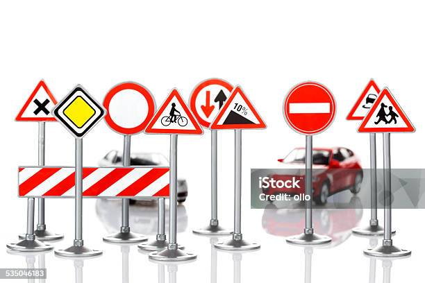 Toy Road Signs And Unrecognisable Defocused Cars Stock Photo - Download Image Now - 2015, Authority, Bicycle