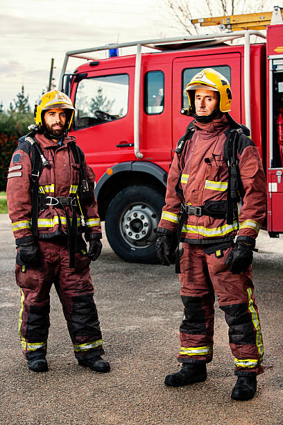 istock Firemen standing next to fire truck. 535069185