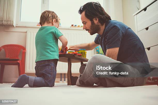 Young Urban Father Playing With His Toddler Son Stock Photo - Download Image Now - 12-17 Months, 18-23 Months, 2015