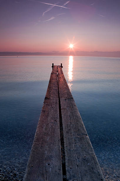 Wooden dock at the edge of a Swiss lake.
