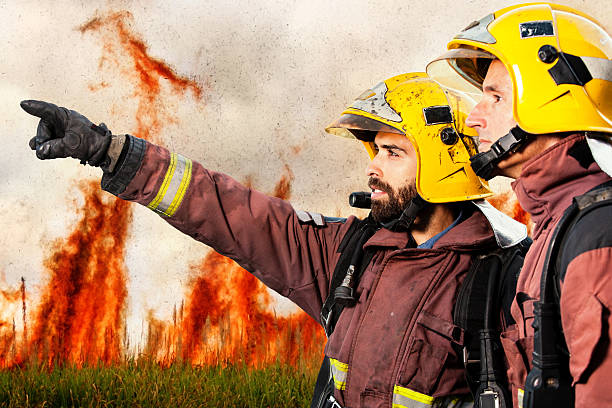 istock Firemen indicating fire to companion. 535073893