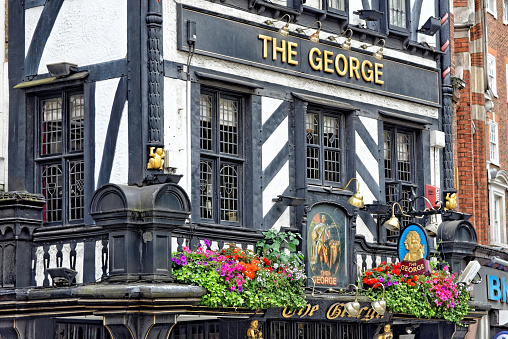 London, United Kingdom - July 1, 2014 : The George on Strand. The spectacular architecture in the opposite side of the Royal Courts of Justice, It is a traditional English pub.