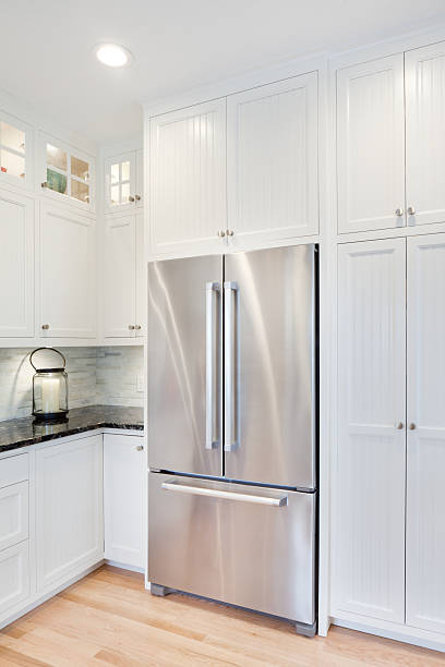 Contemporary Classic Domestic Kitchen Refrigerator Newly updated contemporary classic open concept kitchen with new stainless steel appliances refrigerator, counter top and pantry storage. domestic kitchen cabinet elegance showcase interior stock pictures, royalty-free photos & images