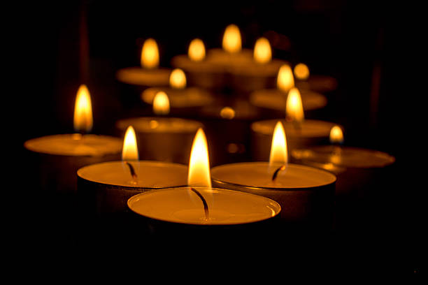 istock Burning candles against a black background 535075817