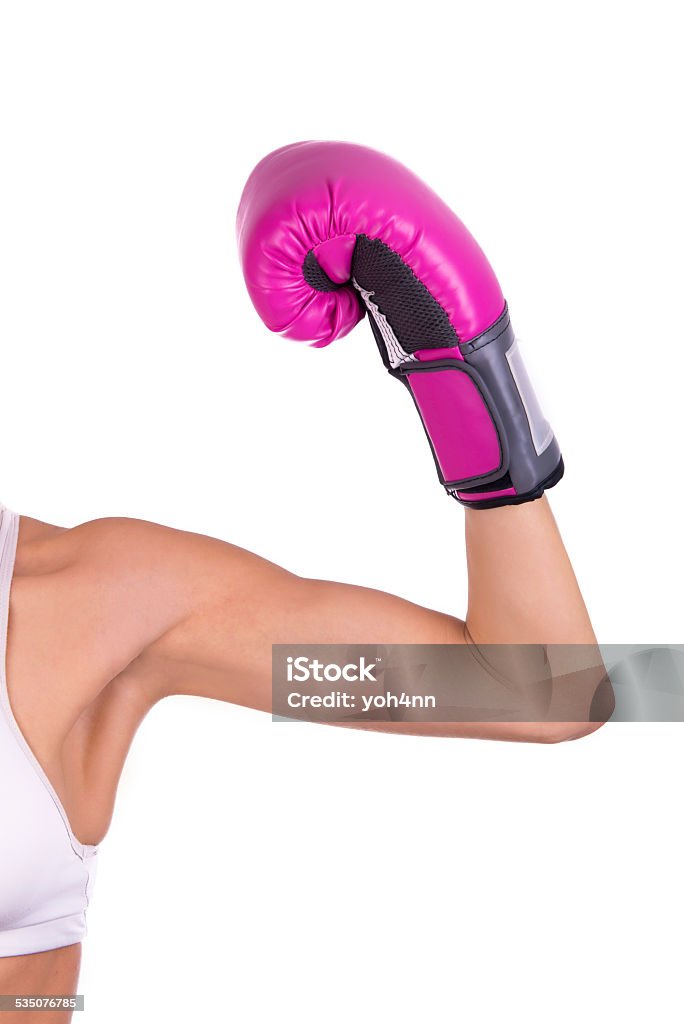 Pink glove in victory Woman's arm raise her pink glove in victory isolated on the white background. Boxing - Sport Stock Photo