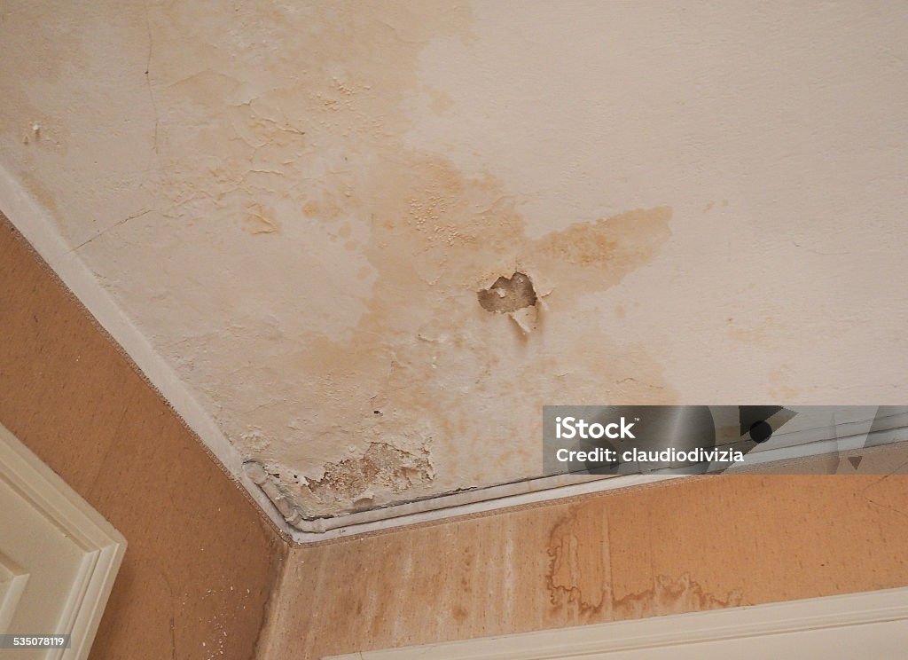 Damp moisture Damage caused by damp and moisture on a wall Ceiling Stock Photo