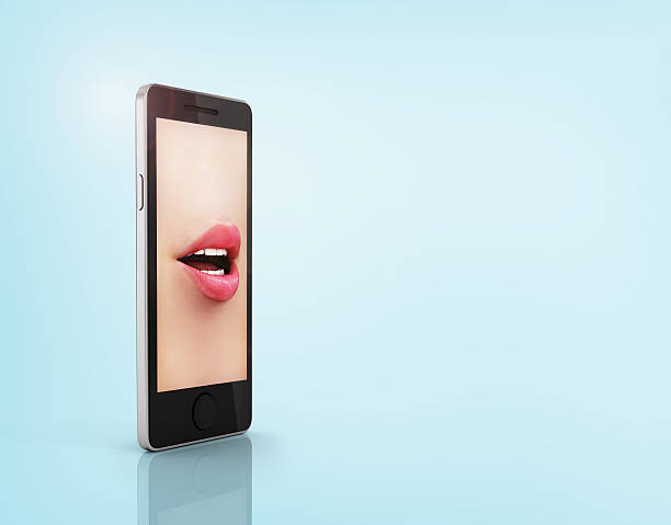 istock Lips in the phone. Concept of a telephone conversation. 535079889