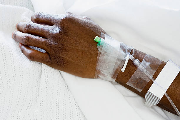 Arm of patient with drip stock photo