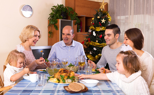 happy parents with adult kids and grandchildren celebrating xmas