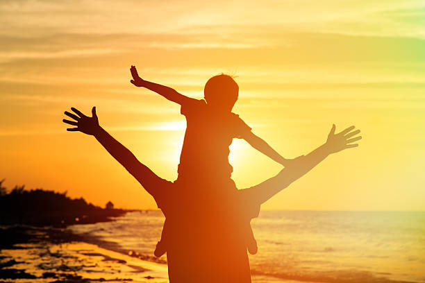 istock father and son having fun on sunset 535108047
