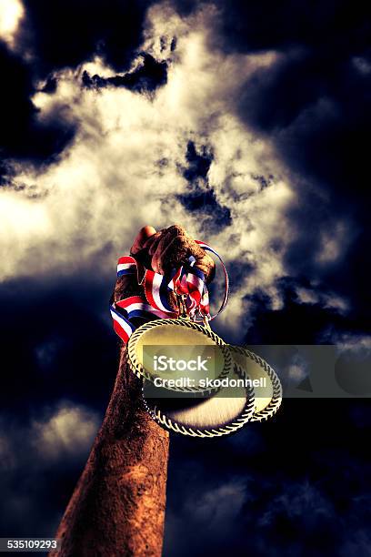 American Victory With Trophy Medallion And Muddy Arm Stock Photo - Download Image Now